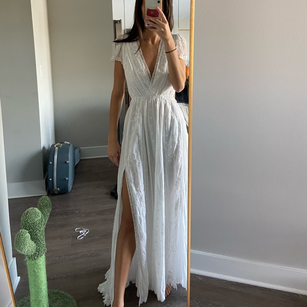 Long white Loveshackfancy dress.